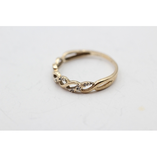 35 - 9ct gold diamond twist ring (1.7g) Size R