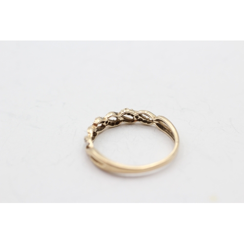 35 - 9ct gold diamond twist ring (1.7g) Size R