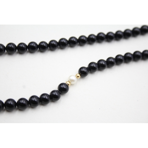 43 - 14ct gold onyx and pearl necklace (22.5g)