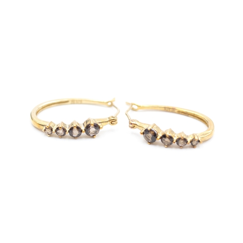 44 - 9ct gold smokey quartz set oval hoop earrings (2.6g)