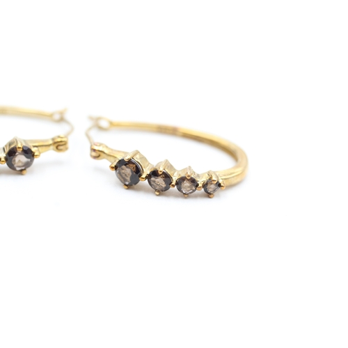 44 - 9ct gold smokey quartz set oval hoop earrings (2.6g)