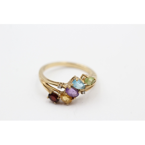 47 - 9ct gold diamond, peridot, amethyst, citrine, garnet and blue topaz cluster row ring (2.4g) Size O