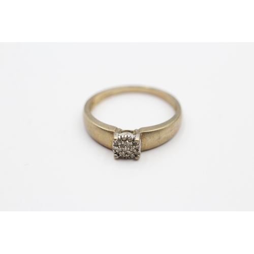 63 - 9ct gold diamond cluster ring (2.4g) Size P