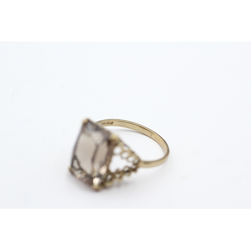 67 - 9ct gold smokey quartz cocktail ring (3.6g) Size Q