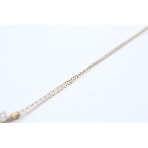 70 - 9ct gold diamond single stone pendant on chain (1.4g)