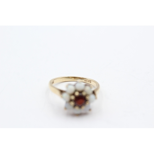 80 - 9ct gold opal and garnet halo ring (2.7g) Size M