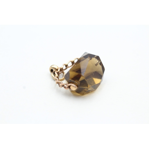 10 - 9ct gold smokey quartz paste spinner fob (5.2g)