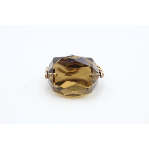 10 - 9ct gold smokey quartz paste spinner fob (5.2g)