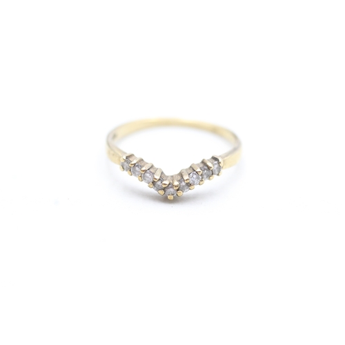 105 - 9ct gold diamond wishbone ring (1.4g) Size N 1/2