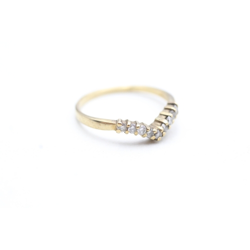 105 - 9ct gold diamond wishbone ring (1.4g) Size N 1/2