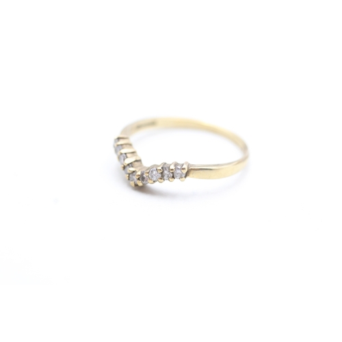 105 - 9ct gold diamond wishbone ring (1.4g) Size N 1/2