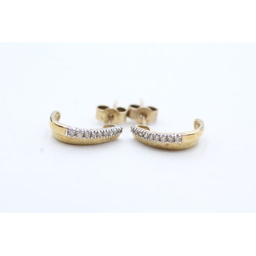 106 - 9ct gold diamond half hoops earring (1g)