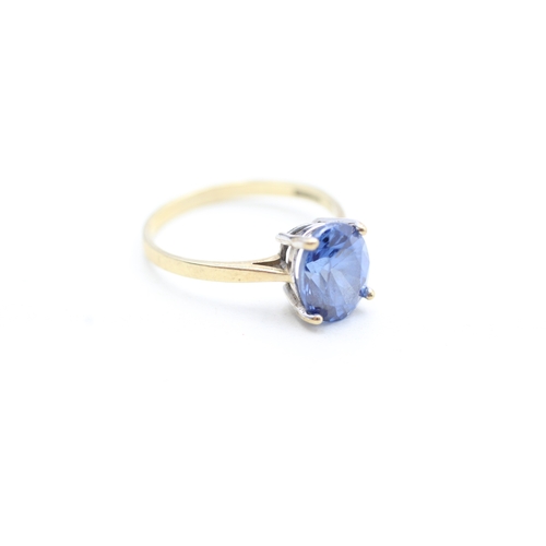 107 - 9ct gold blue gemstone set solitaire ring (2.1g) Size N 1/2