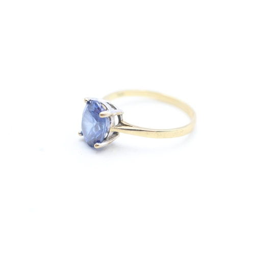 107 - 9ct gold blue gemstone set solitaire ring (2.1g) Size N 1/2