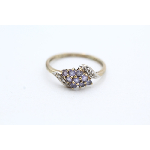 118 - 9ct gold tanzanite and diamond cluster twist ring (1.6g) Size P