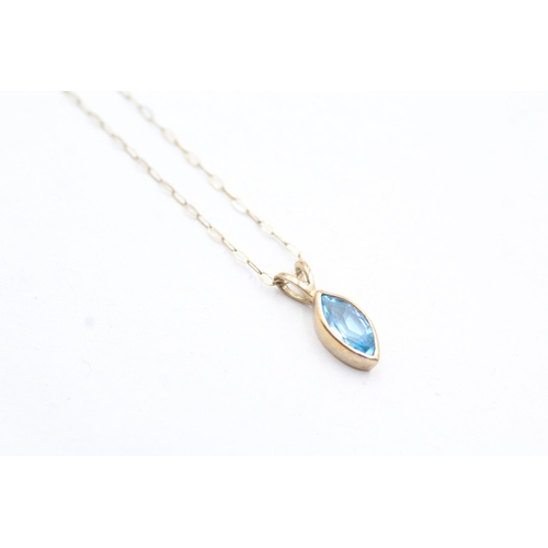 123 - 9ct gold marquise cut blue topaz pendant necklace (0.9g)