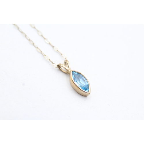 123 - 9ct gold marquise cut blue topaz pendant necklace (0.9g)