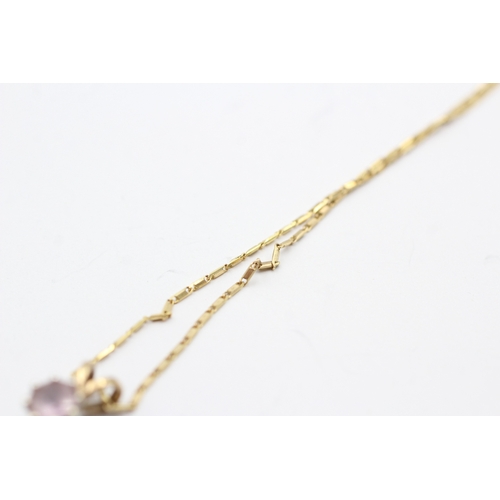 133 - 9ct gold pink topaz single stone pendant on chain (2.4g)