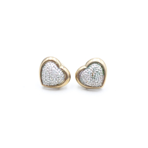 135 - 9ct gold parve set diamond heart shape stud earrings (2.3g)