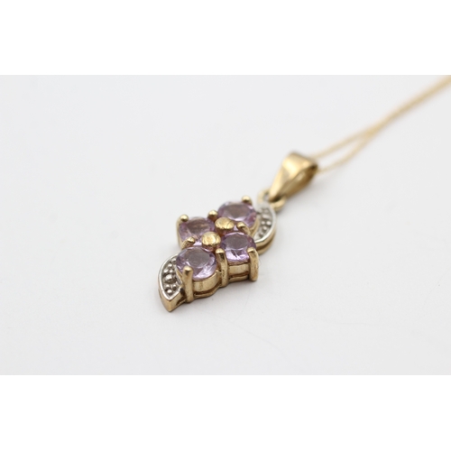 136 - 9ct gold amethyst twist pendant on chain (1.9g)