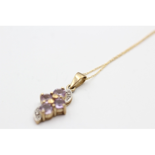 136 - 9ct gold amethyst twist pendant on chain (1.9g)