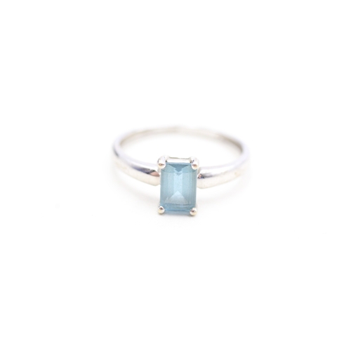 137 - 9ct gold emerald cut blue topaz set solitaire ring (1.9g) Size Q