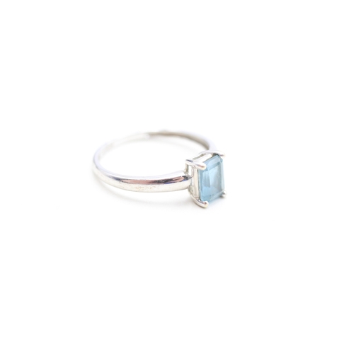 137 - 9ct gold emerald cut blue topaz set solitaire ring (1.9g) Size Q