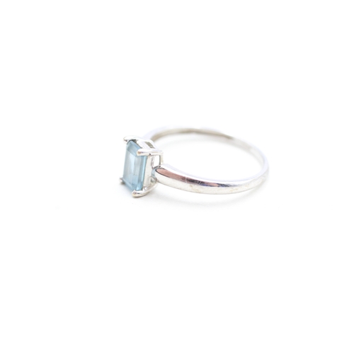 137 - 9ct gold emerald cut blue topaz set solitaire ring (1.9g) Size Q