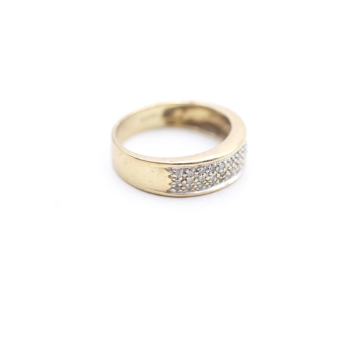 145 - 9ct gold diamond set band ring (4g) Size N