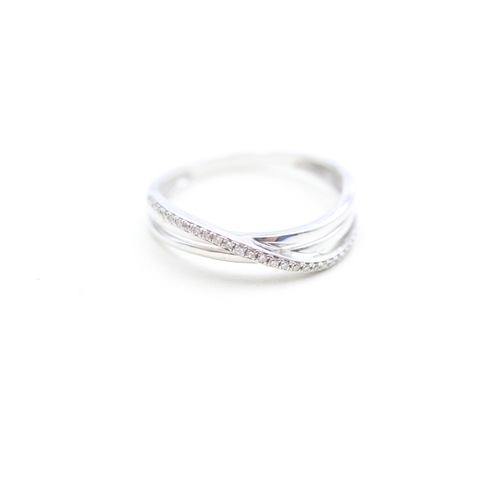 174 - 9ct white gold diamond twist ring (2.1g) Size P