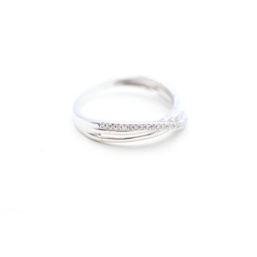 174 - 9ct white gold diamond twist ring (2.1g) Size P