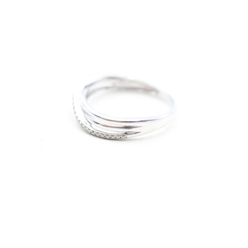 174 - 9ct white gold diamond twist ring (2.1g) Size P