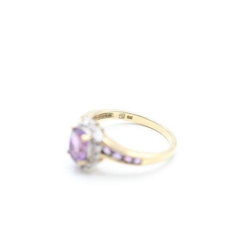 177 - 9ct gold amethyst and diamond halo twist ring (2.8g) Size P