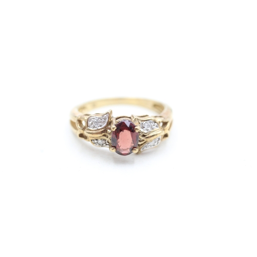 218 - 9ct gold diamond and garnet set dress ring (3.4g) Size N 1/2