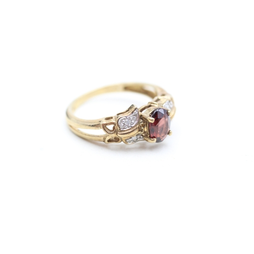 218 - 9ct gold diamond and garnet set dress ring (3.4g) Size N 1/2