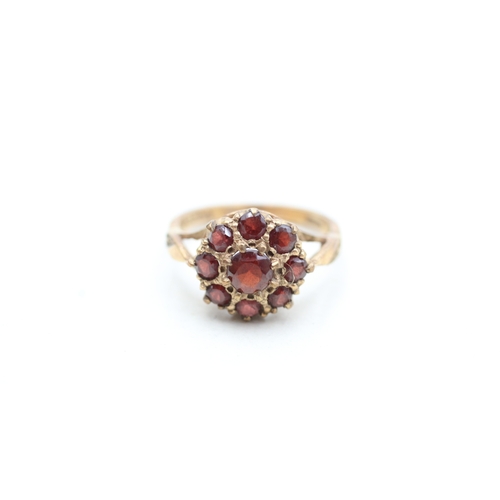 22 - 9ct gold garnet halo cluster ring (3.2g) Size L