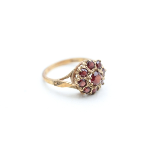 22 - 9ct gold garnet halo cluster ring (3.2g) Size L