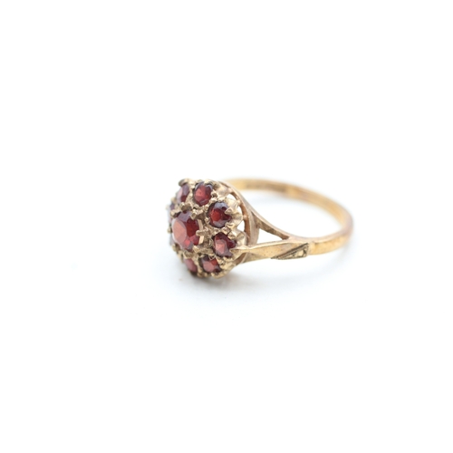 22 - 9ct gold garnet halo cluster ring (3.2g) Size L