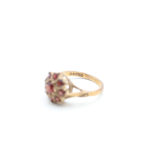 22 - 9ct gold garnet halo cluster ring (3.2g) Size L