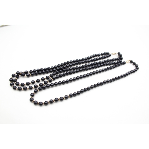 222 - 2x 9ct gold black onyx necklaces (57.7g)