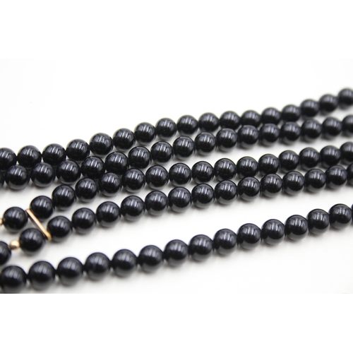 222 - 2x 9ct gold black onyx necklaces (57.7g)