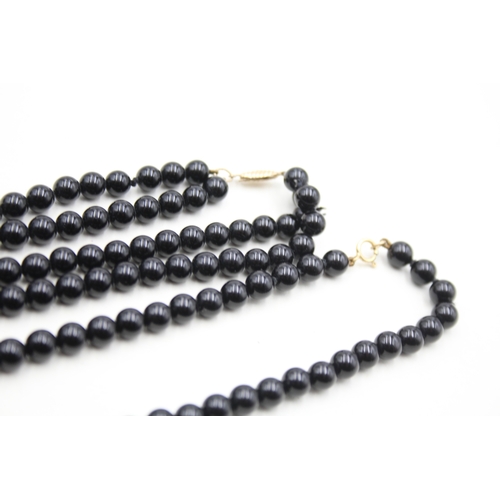 222 - 2x 9ct gold black onyx necklaces (57.7g)