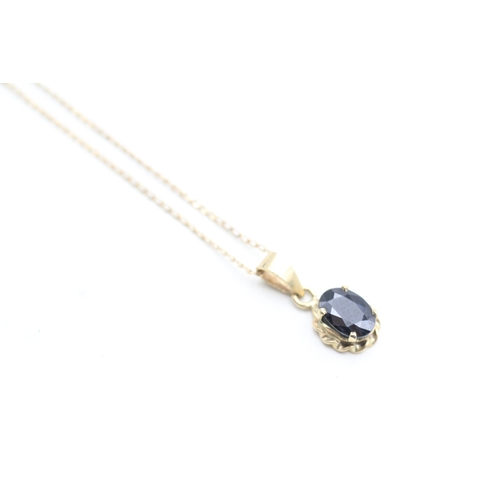 234 - 9ct gold sapphire set pendant necklace (1.5g)