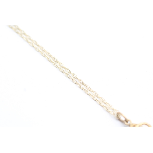 239 - 9ct gold diamond knot pendant on chain (1.7g)