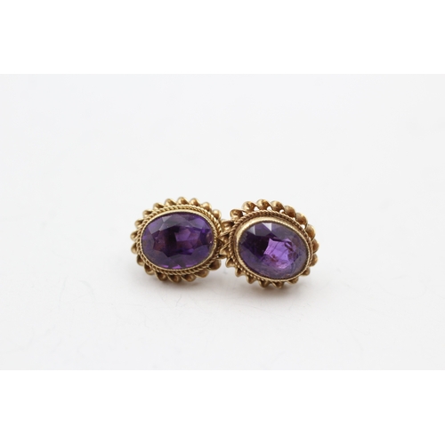 245 - 9ct gold amethyst stud earrings (2.4g)