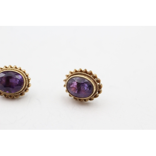 245 - 9ct gold amethyst stud earrings (2.4g)