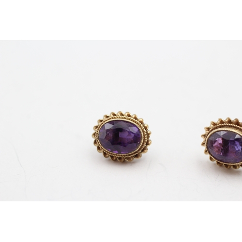 245 - 9ct gold amethyst stud earrings (2.4g)