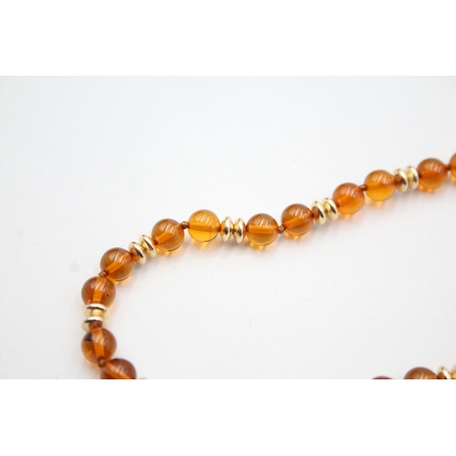 29 - 9ct gold amber and gold spacer beaded necklace (8.4g)