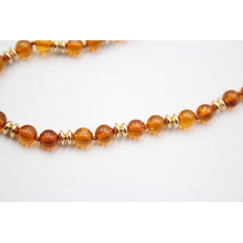 29 - 9ct gold amber and gold spacer beaded necklace (8.4g)