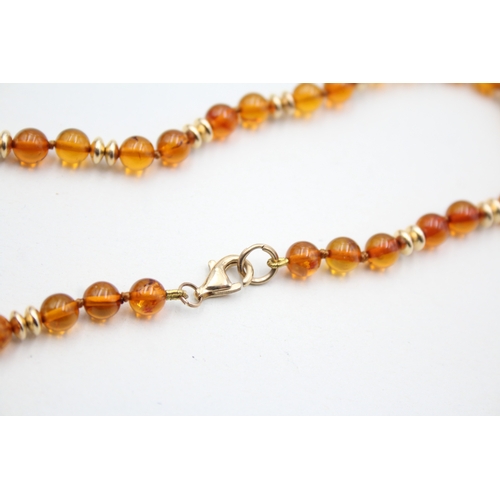 29 - 9ct gold amber and gold spacer beaded necklace (8.4g)